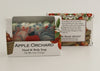 Bars of soap in custom packaging with apple and swirl design