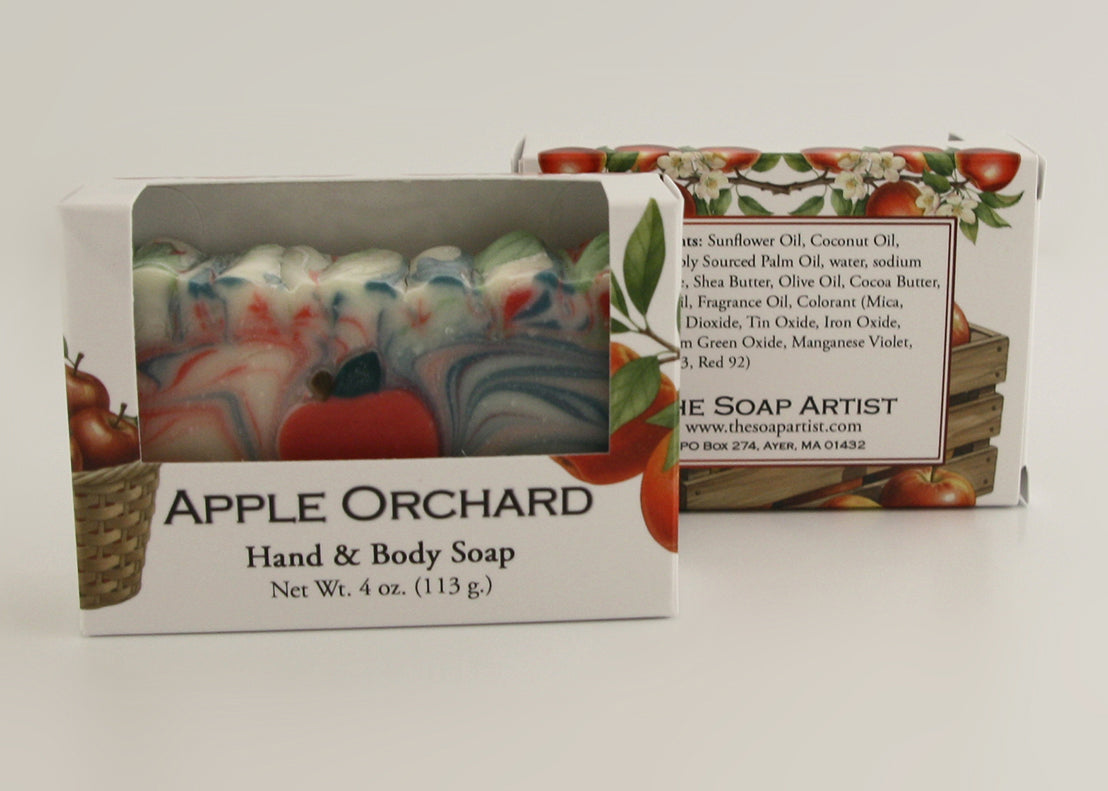 Bars of soap in custom packaging with apple and swirl design