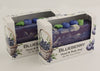 Bars of soap in custom packaging with blueberry and swirl design