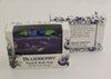Bars of soap in custom packaging with blueberry and swirl design