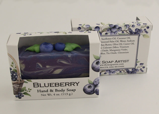 Bars of soap in custom packaging with blueberry and swirl design