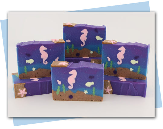Ocean bottom scene soap with seahorse, fish, and shells.