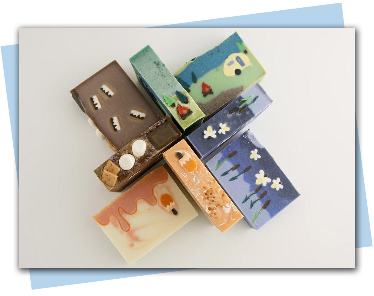 Summer collection of bars featuring smores, orange creamsicle, sunlit pines, and sunset at the lake
