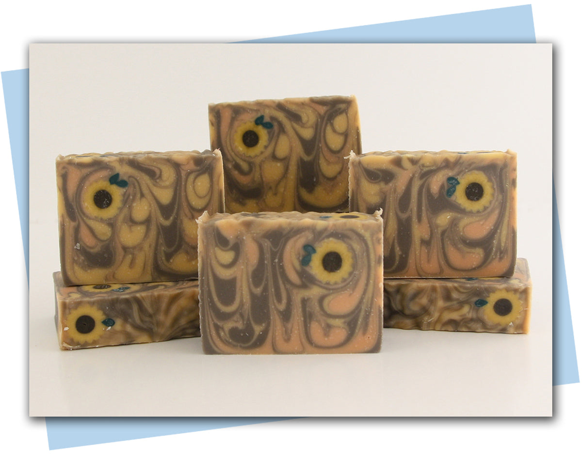 yellow orange brown swirl with sunflowers embed on bars of soap