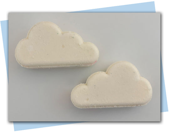 Cloud shaped bath bomb white on outside hidden color on inside.