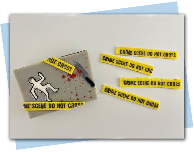 Mystery Stamp set included crime scene tape, a bloody handprint and footprints