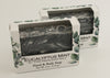 Bars of soap in custom packaging with black and white swirl design