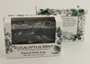 Bars of soap in custom packaging with black and white swirl design