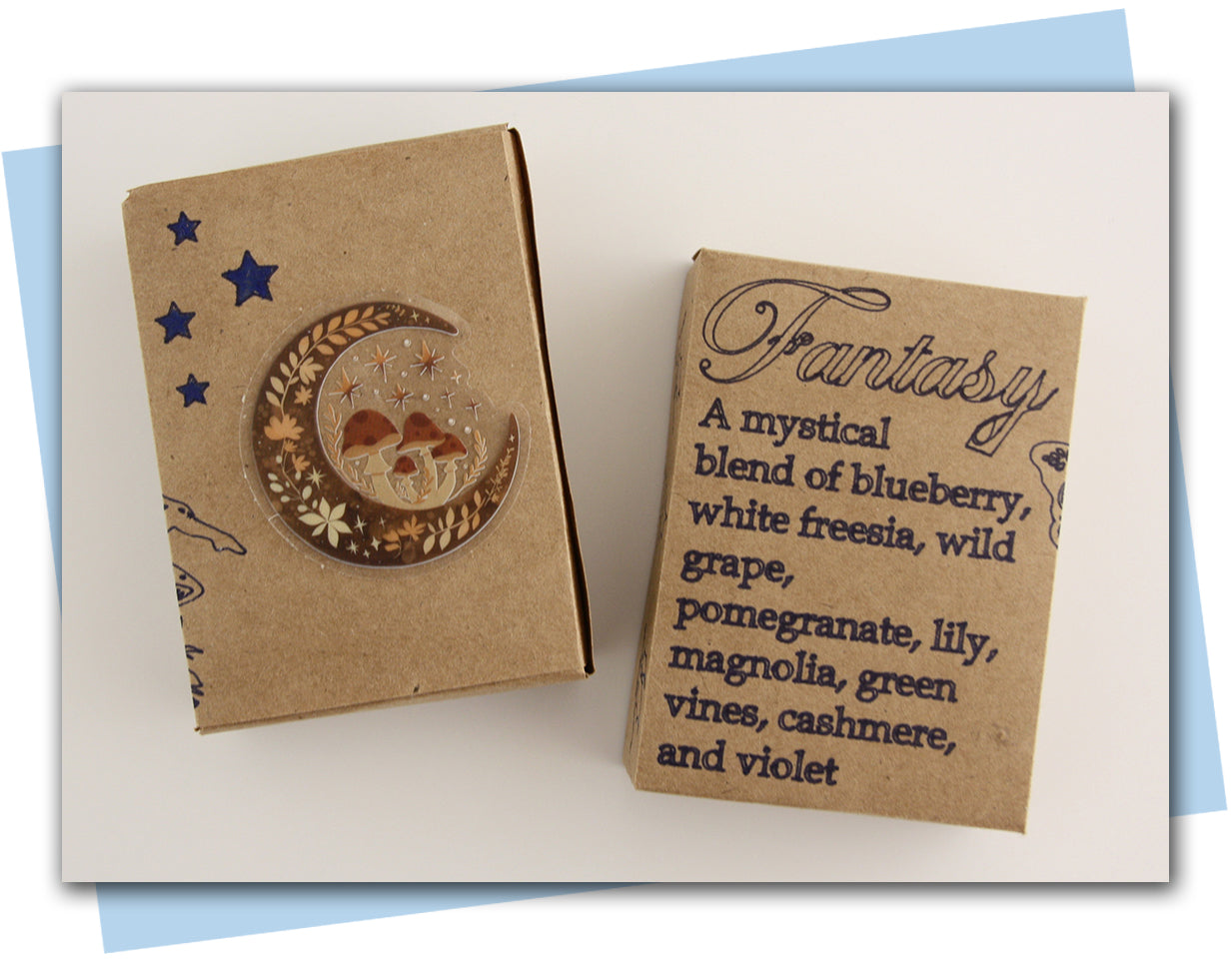Two cardboard boxes with decorative designs and text on a white background Fantasy Themed