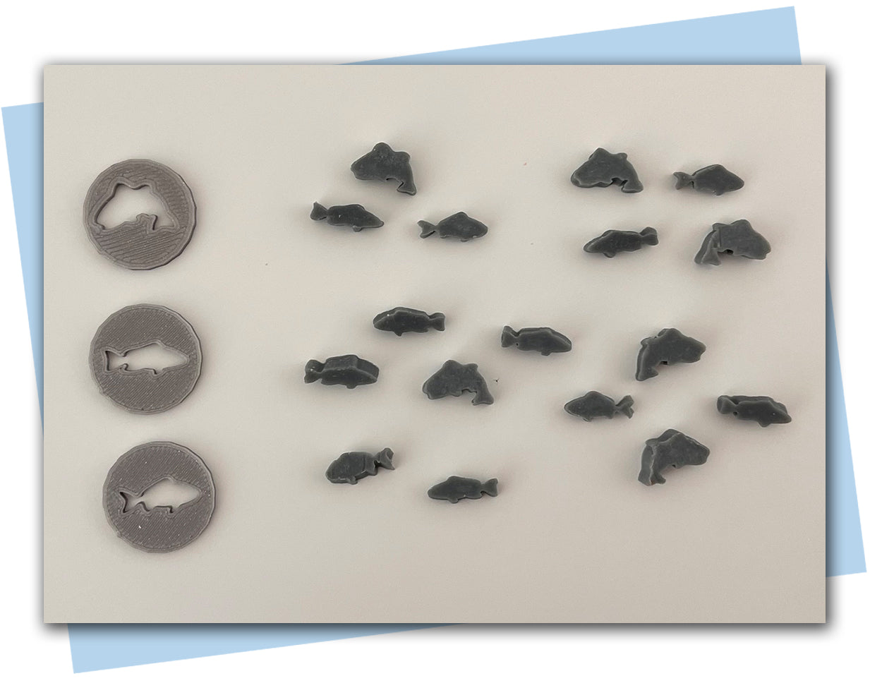 set of three fish extruder discs swimming in ocean