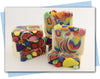 Bars of soap with rainbow swirl and fruit soap toppings