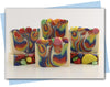 Bars of soap with rainbow swirl and fruit soap toppings