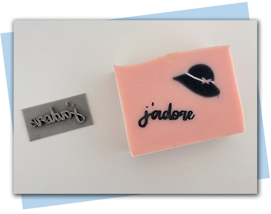 a soap stamp that says j'adore