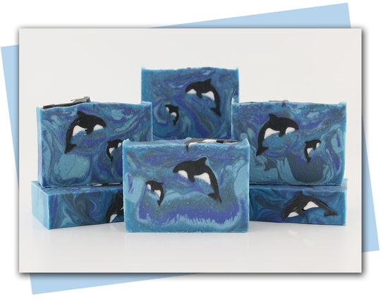 Momma and baby orca swimming in an ocean design bars of soap