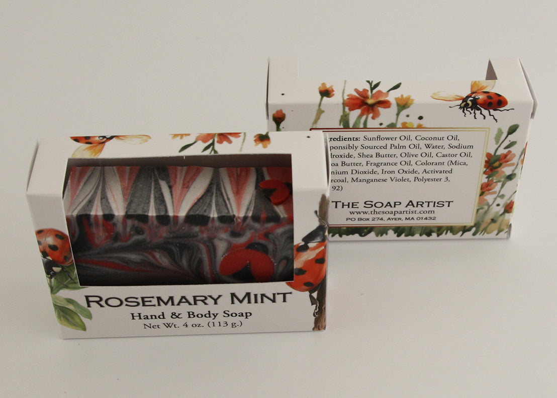 Bars of soap in custom packaging with ladybug embed and swirl design