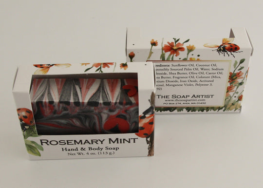 Bars of soap in custom packaging with ladybug embed and swirl design