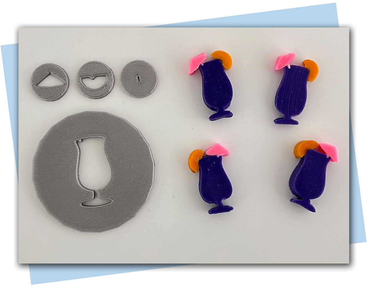 large cocktail extruder disc with fun umbrella and orange slice