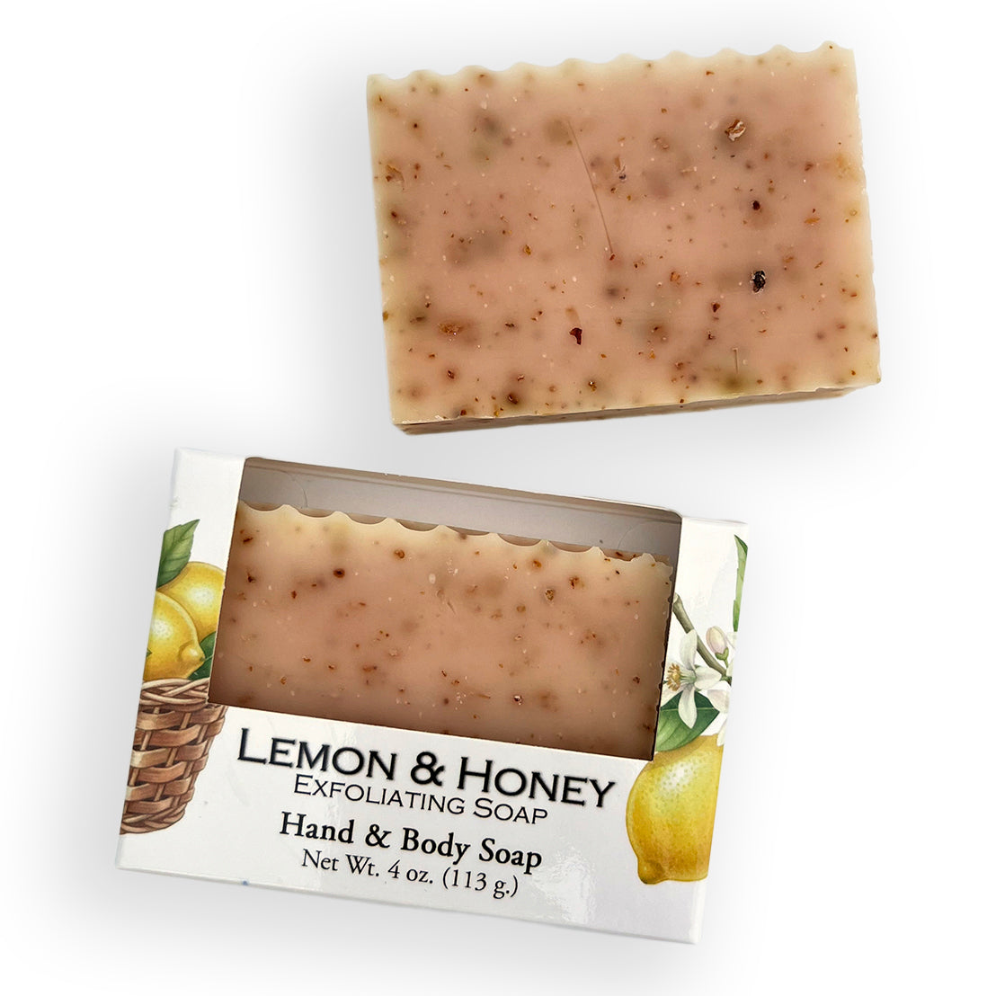 A bar of lemon and honey exfoliating hand and body soap shown both unwrapped above its illustrated retail box on a white background.