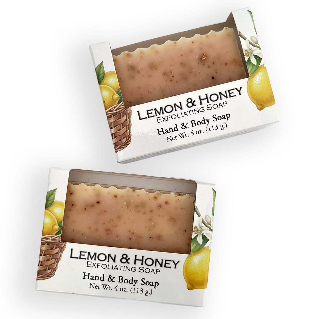 Two boxed bars of Lemon & Honey Exfoliating Hand & Body Soap shown on a white background, with the soap visible through clear windows on the packaging.
