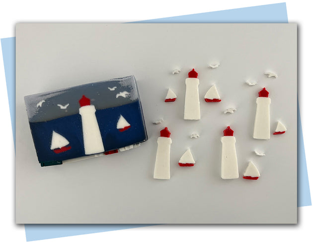 Lighthouse, sailboat, and seagull extruder discs