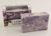 Bars of soap in custom packaging with purple and white  swirl design