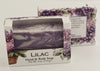 Bars of soap in custom packaging with purple and white  swirl design