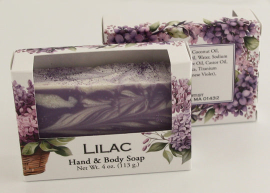 Bars of soap in custom packaging with purple and white  swirl design