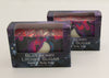 Bars of soap in custom packaging with moon embed and swirl design in black and neon colors