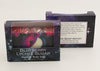 Bars of soap in custom packaging with moon embed and swirl design in black and neon colors