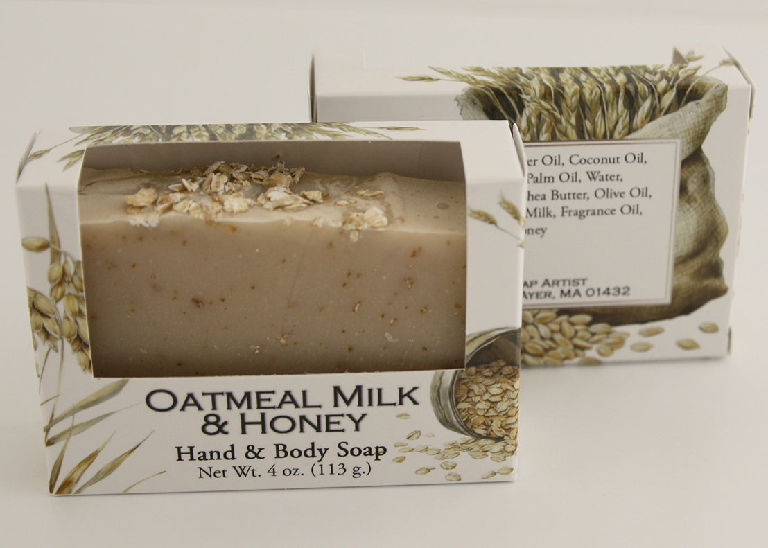 Bars of soap in custom packaging with oatmeal and milk brown bar design