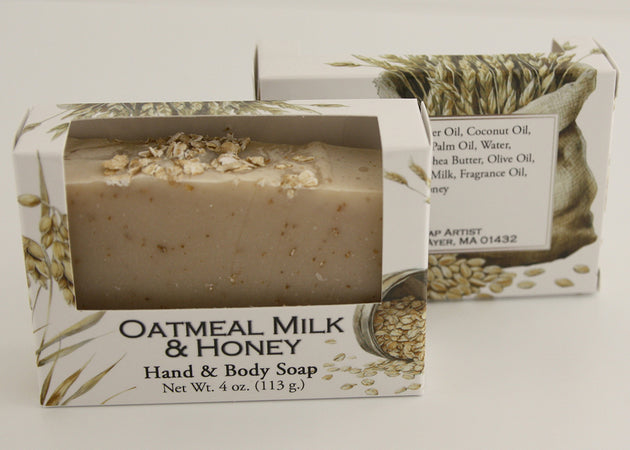 Bars of soap in custom packaging with oatmeal and milk brown bar design