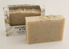 Bars of soap in custom packaging with oatmeal and milk brown bar design