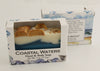Bars of soap in custom packaging with seashells on top and ocean blue design for the bar