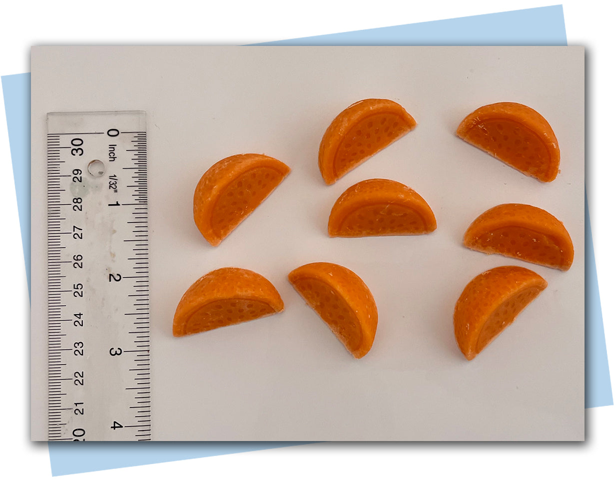 Orange slices soap embellishments with ruler for scale
