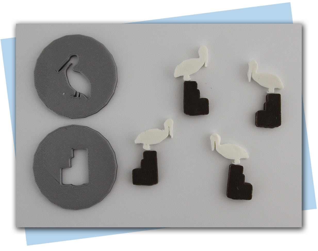 pelican standing on pier extruder disc set