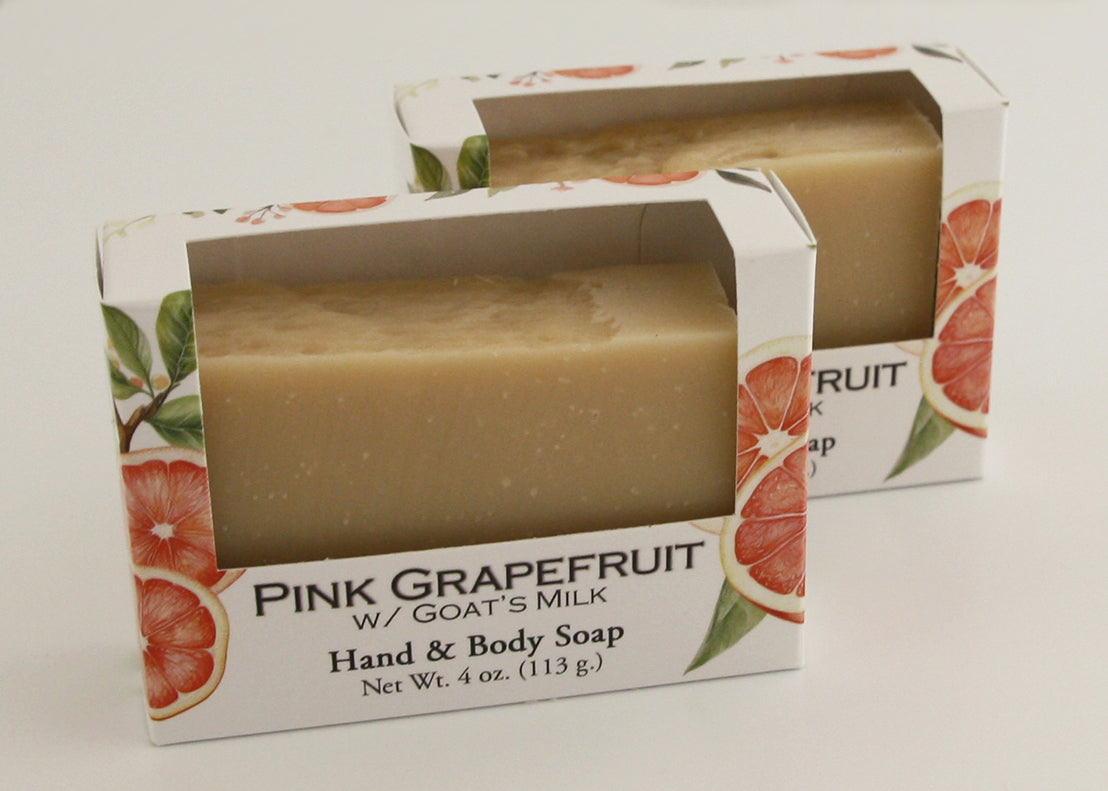 Bars of soap in custom packaging plan orange bar made with milk and no color added