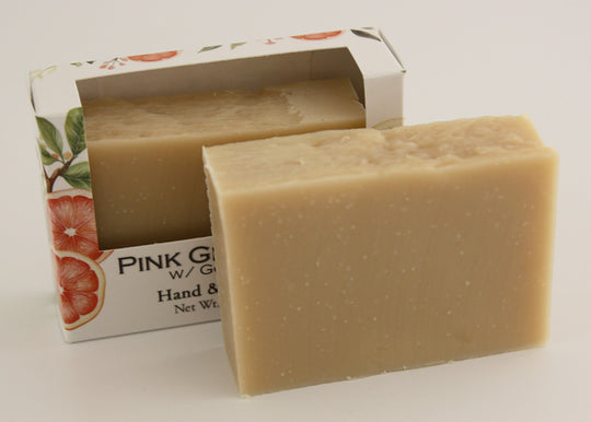 Bars of soap in custom packaging plan orange bar made with milk and no color added
