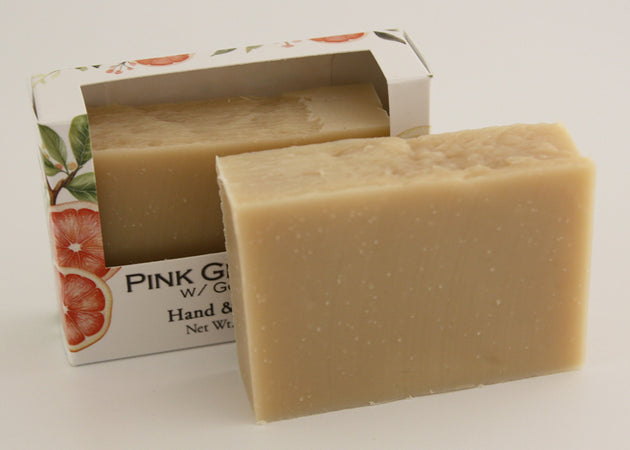 Bars of soap in custom packaging plan orange bar made with milk and no color added
