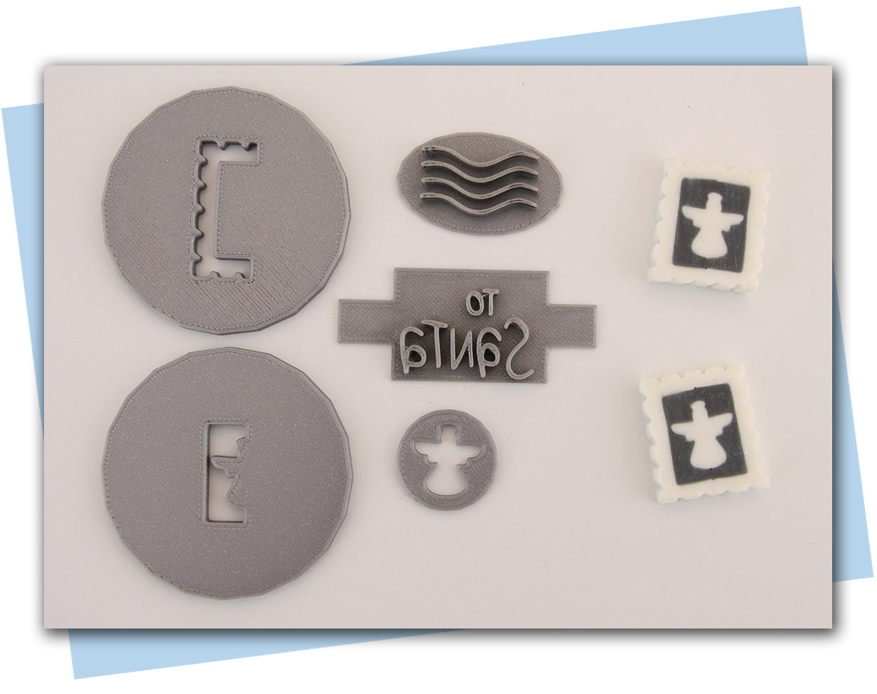Holiday postage stamp extruder discs angel