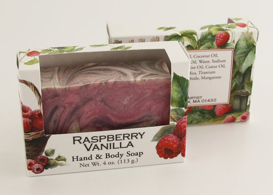 Bars of soap in custom packaging with purple, pink, and white swirl design