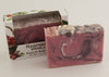 Bars of soap in custom packaging with purple, pink, and white swirl design