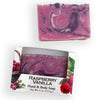 Bars of soap in custom packaging with purple, pink, and white swirl design