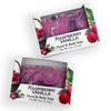 Bars of soap in custom packaging with purple, pink, and white swirl design