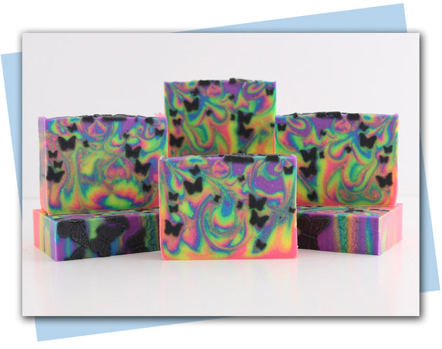 Neon swirled rainbow soap with black butterfly embeds