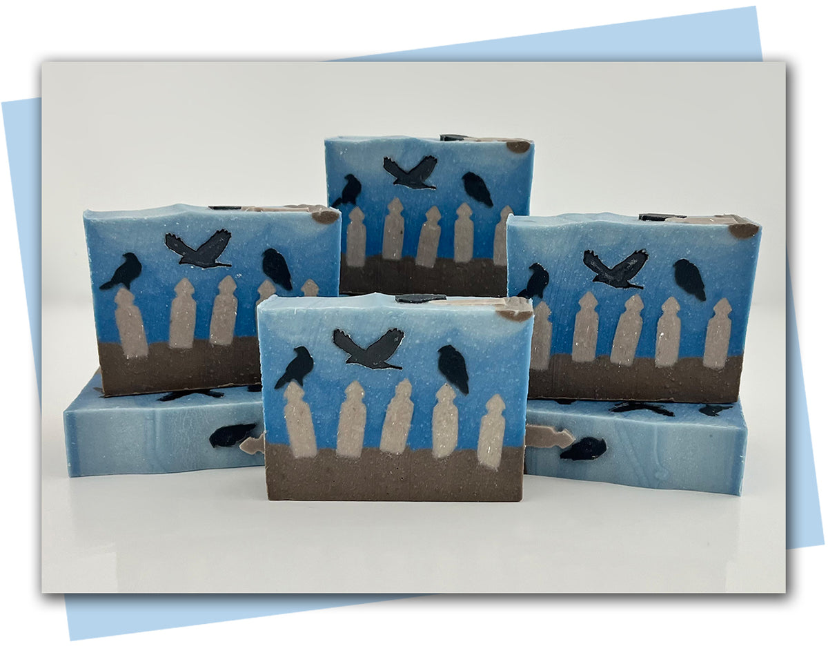 Bars of soap with an old broken fence and ravens sitting on it design