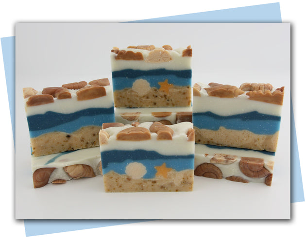 beach and ocean cold process soap design with shell and starfish embeds
