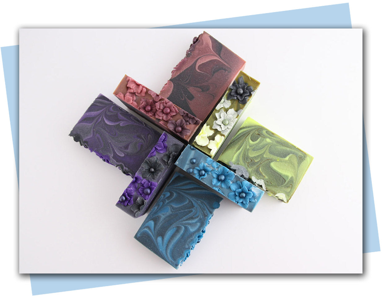 Blue flower tops with blue and black ombre swirl bars of soap