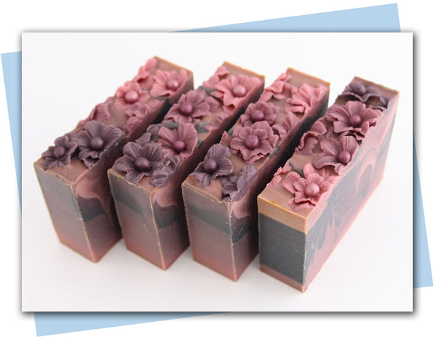 plum ombre flowers in a plum to black ombre swirled bars of soap