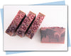 plum ombre flowers in a plum to black ombre swirled bars of soap