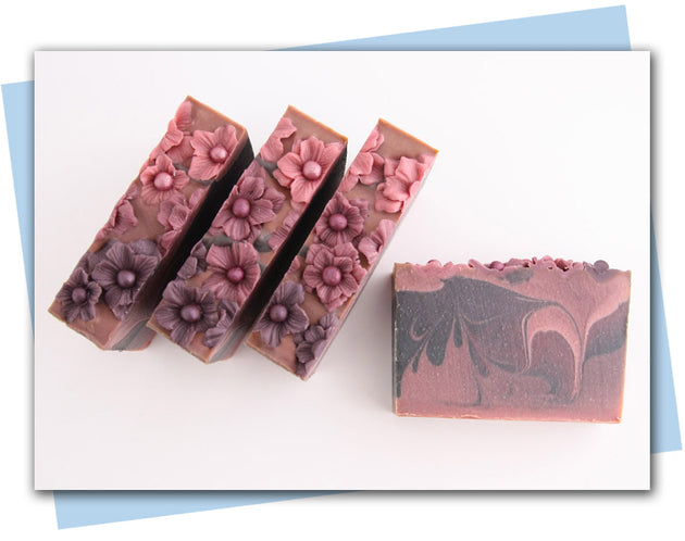 plum ombre flowers in a plum to black ombre swirled bars of soap